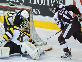 Peterborough Petes' Greg Betzold scores on Kingston Frontenacs goalie Mike Morrison next to Roland McKeown during first-period OHL action on March 7, 2013 at the Memorial Centre in Peterborough. The Petes and Frontenacs meeting Thursday at 7 p.m. at the Memorial Centre. Clifford Skarstedt/Peterborough Examiner/QMI Agency