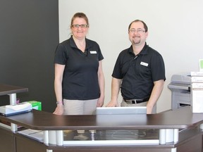 Liz Kadziolka, RPN for Complete Foot Care in Timmins and registered chiropodist, Patrick Rainville setting up the Rainville Health satellite clinic in Cochrane.