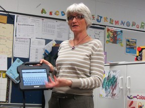 Jacqueline Neibrandt demonstrates an adaptive tool during a presentation on the Foundations for Learning program based out of Ecole Crescentview School, Thursday, during the regular meeting of the board of trustees.