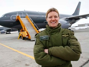 At only 31, Capt. Sophie Polwin has been flying Canada's Airbus C-150 Polaris with 437 Transport Squadron at 8 Wing/CFB Trenton, Ont. for three years. She is the second female pilot to earn her wings with the airline and transport squadron. She is seen here in front of one of the squadron's fleet of five aircraft at the Trenton air base Thursday, March 7, 2013.  JEROME LESSARD/The Intelligencer/QMI Agency