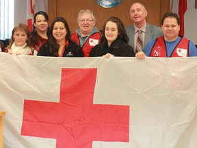 The Red Cross celebrated the official Mayoral decree of March becoming Red Cross month in the City of Timmins by showing up to Timmins Council Chambers in force on Tuesday morning. The humanitarian organization is currently celebrating more than 100 years of world wide service. Back row, from left, are Christine Rickard, Jim Lanthier and Mayor Tom Laughren. Front row, from left, are Ginnette Belair, Serenna Besserer, Caroline Caron, Tim Trevenna and Patricia Leonard.