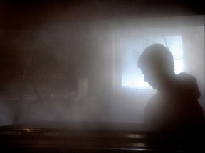 Jeff Haffie is almost obscured by the abundance of steam rolling off the maple syrup boiler at Gibbons Family Farm on Wednesday. (DARCY CHEEK/The Recorder and Times)