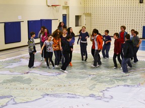 Pictured: The Grade 6/7 class at Northport Elementary School in Port Elgin have been learning about the War of 1812 using the Canadian Geographical Education’s Giant Floor Map to help their understanding of what went on in Canada’s history through various activities.