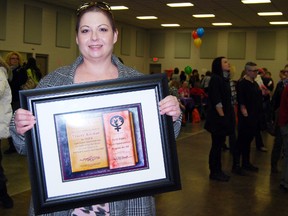 Tracey Kaiman, owner of Eden Bella Boutique in Woodstock received this year's AppreSheaction at Oxford County's annual International Women's Day free event at the Oxford Auditorium Friday, March, 8, 2013. 
TARA BOWIE / SENTINEL-REVIEW / QMI AGENCY