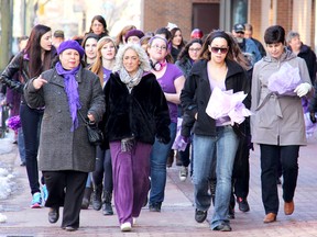 Approximately 50 people strolled through downtown Chatham, Ont., on Friday, March 8, 2013, for the first Women Walking Together In Celebration event, organized by Patricia Clarke, left front, as fun way to mark International Women's Day. ELLWOOD SHREVE/ THE CHATHAM DAILY NEWS/ QMI AGENCY