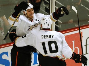 Anaheim Ducks' Ryan Getzlaf (left) celebrates his goal against the Chicago Blackhawks with teammate Corey Perry during NHL action in Chicago, February 12, 2013. (REUTERS/Jim Young)