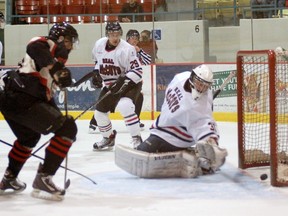 Brantford Blast's Scott Duncan watches the puck go by Dundas Real McCoys goalie Brock Novak Friday during Game 1 of the Allan Cup Hockey final series. (DARRYL G. SMART The Expositor)