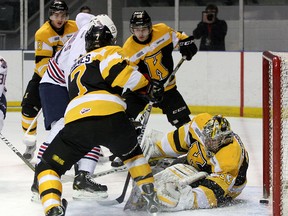 Oshawa Generals’ Justice Dundas scores on Kingston Frontenacs goalie Mike Morrison as Frontenacs Ryan Hanes and Sam Povorozniouk come in too late to help during Ontario Hockey League action at the K-Rock Centre on Friday night. The Generals won 5-2. (Ian MacAlpine/The Whig-Standard)