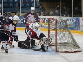 Brock Crossthwaite makes a save on Stephen Langford during third period action Friday night during the Trappers game against Blind River. North Bay won the game 5-2.