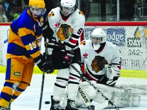 Brockville Braves defenceman Ryan Walter and Carleton Place Canadians captain Luke Martin collide in front of the net as they battle for a loose puck in Friday night's game at the Memorial Centre. (AUSTIN DE LUIS The Recorder and Times)