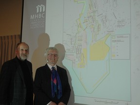 MHBC Planning Ltd. project manager David Cuming, and Central Elgin Coun. Sally Martyn stand in front of a heritage district boundary map Wednesday in Port Stanley. MHBC held an open house about the possiibility of a heritage district in the port community and the work the firm will undertake over the next few months.