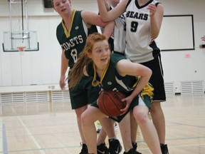 Kaitlyn Weisberg of the senior girls' Melfort Comets baskteball team wraps up a rebound during the Comets' 37-26 victory over the Lp Miller Bears on Friday night at the MUCC gym.