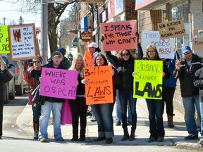 Protesters in Markdale on Saturday call for changes to animal welfare laws.