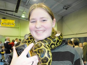 SARAH DOKTOR Simcoe Reformer
Meg Hess-Woodcock, 15, of Ingersoll got up close and personal with a snake at the Norfolk Wildlife Festival and Adventure Show at the Aud on Mar. 9.