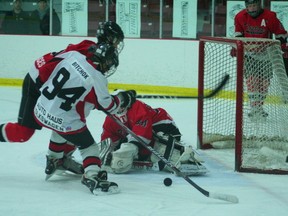 Kenora's Brandon Scott stretches across the red line to stop the Seine River player from scoring a goal. The Bantam Thistles lost 3-0 to the Snipers, ending their season without an Eastman League Championship title.

GRACE PROTOPAPAS/KENORA DAILY MINER AND NEWS/QMI AGENCY