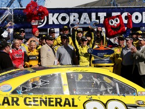 Matt Kenseth celebrates in Victory Lane after winning the NASCAR Sprint Cup Series Kobalt Tools 400 at Las Vegas Motor Speedway on Sunday. (GETTY IMAGES)