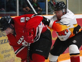 Corey Stringer of the Brantford Blast ties up Dundas Real McCoys' Brad Jackson Sunday at JL Grightmire Arena in Game 2 of the best-of-seven Allan Cup Hockey championship series. (DARRYL G. SMART The Expositor)
