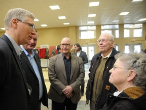 (From Left): Verlyn Olson, Alberta minister of agriculture and rural development, Wayne Drysdale, Grande Prairie-Wapiti MLA, Everett McDonald Grande Prairie-Smoky MLA, meet with members of the farm family of the year Bennie Everton (second from right) and Audrey Everton (right) on Friday at the 28th Peace Country Classic Agri-Show. (Patrick Callan/Daily Herald-Tribune)