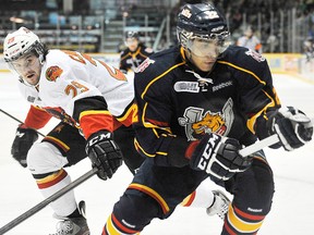 Belleville Bulls defenceman Jake Cardwell covers Barrie Colts forward Andreas Athanasiou during OHL game in Barrie Saturday night. (Mark Wanzel/QMI)