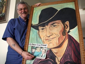 Yvon Lapierre, an old friend of late Canadian music icon Stompin' Tom Connors, displays the portrait that hung in the Maple Leaf Hotel. The painting, which harkened to Connors’ professional start in Timmins, was given to Lapierre by the hotel’s owner, Roger Richard shortly after the tavern closed in 2002.