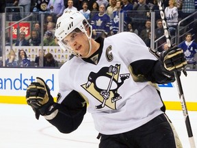 Penguins forward Sidney Crosby celebrates after scoring the game-winning shootout goal against the Maple Leafs at the Air Canada Centre in Toronto, Ont., March 9, 2013. (FRED THORNHILL/Reuters)