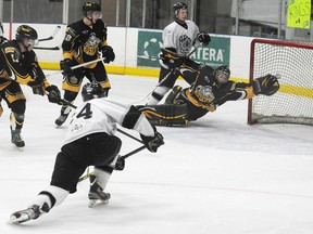 Grande Prairie King Morgan Eaton (bottom left) beats Fort St. John Huskies goalie Travis McLean with a one-timer for a 2-0 GP lead. The Kings went on to beat the Huskies 3-2 in overtime to take the North West Junior Hockey League best-of-seven semifinal series in five games. McLean was brilliant in a losing effort on Saturday, stopping 61 of 64 shots.The Kings will meet the North Peace Navigators in the final, starting Thursday at the Coca-Cola Centre. (TERRY FARRELL/DAILY HERALD-TRIBUNE)