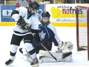 AMANDA SMITH QMI Agency
A member of the North Bay Ice Boltz tries to get a backhand past Sudbury Lady Wolves netminder Stephanie Pascal during regional playdown action in North Bay on Saturday.