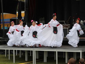 A Mexican dance group of seven girls dances to ‘La Bruja,’ a song from Veracruz, Mexico at Party in the Park on Sept. 1.
Johnna Ruocco | Whitecourt Star