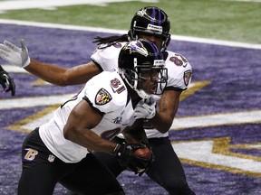 Baltimore Ravens wide receiver Anquan Boldin (L) celebrates his touchdown against the San Francisco 49ers with teammate Torrey Smith during the first quarter in the NFL Super Bowl XLVII football game in New Orleans, Louisiana, February 3, 2013.  (REUTERS)