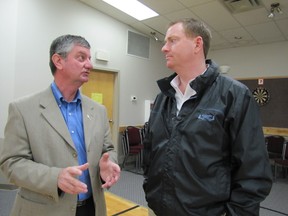 Mayor Jim Rennie, right, and MLA George VanderBurg of Whitecourt - Ste. Anne constituency, chat at a meeting called by the MLA, who is the Associate Minister of Seniors, for the introduction of the government’s budget.