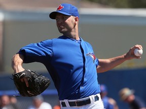 Jays pitcher J.A. Happ delivers a pitch during spring training. (DAVE ABEL/Toronto Sun)
