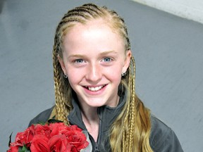 Olivia Stallaert of Chatham will help collect gifts thrown on the ice at the world figure skating championships this week in London. (MARK MALONE/The Daily News)