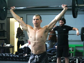 Dave Emery, front, and Nathan Godbout, back, perform snatches during the 2013 Reebok CrossFit Open. The first workout was revealed on Wednesday, March 6 and here in Kenora CrossFit Core KTown participated on Saturday, March 9.
GRACE PROTOPAPAS/Daily Miner and News