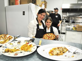 Filipa, left, and Amelia Martins present some of The Pizza Farm’s wares to hungry guests at the Ottawa Valley Food Co-op’s Feast of the Farms tasting event, where 15 local food producers came together at the Eganville Snodrifters clubhouse on Saturday evening to show just how varied and delicious home-grown meat, produce and recipes can be. For more community photos please visit our website photo gallery at www.thedailyobserver.ca.