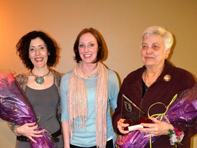 Keynote speaker Cara Mumford, International Woman’s Day committee member and community and fund development coordinator for the Woman’s House Serving Bruce and Grey, Tiffany Love, and the 2013 Woman of Distinction, Maryanne Buelow are recognized during the International Woman's Day celebration at Lakeshore Recreation in Port Elgin, Friday evening.