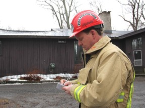 Fire inspector Del Blakney begins his investigation Tuesday morning into a house fire north of Hwy. 2, east of the city, that broke out Monday night and heavily damaged the attic and roof of the home.
Michael Lea The Whig-Standard