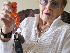 Retired driver Alice MacKenzie, 91, holds up her keychain -- sans car keys -- in her Sarnia, Ont. apartment Wednesday, March 6, 2013. MacKenzie sold her car last month, wrapping up a 75-year driving record with no accidents under her belt. BARBARA SIMPSON / THE OBSERVER / QMI AGENCY