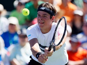 Milos Raonic returns a shot against Marin Cilic of Croatia during their match at the BNP Paribas Open in Indian Wells, Cal., March 12, 2013. (REUTERS/Danny Moloshok)