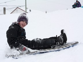Aedan Verreault had no complaints about Tuesday's snowfall, as he enjoys a ride down Confederation Hill in Timmins. Aedan was just one of many sledders at the hill, among them, his mother, Kylee, and his siblings, Dante and Abigail.