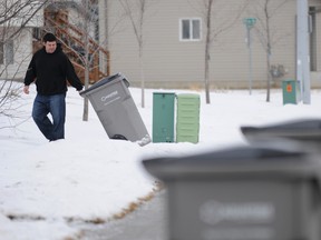 During the city’s community safety committee meeting Tuesday an issue was raised over garbage pickup in neighbourhoods where the houses don't have front driveways. (DHT file photo)