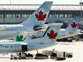 Air Canada aircraft are seen at Toronto Pearson International Airport, in this September 20, 2011file photo. (REUTERS/Mark Blinch/Files)
