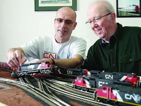 Paul Hunter shows Graham Oberst the HO scale switching layout he will be bringing to Kingston’s Rail-O-Rama.    Rob Mooy-Kingston This Week