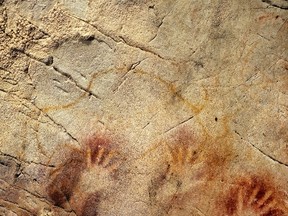 The Panel of Hands in El Castillo Cave near the village of Puente Viesgo created by Neanderthals.  REUTERS/Image courtesy of Pedro Saura/Handout