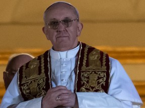 Argentina's Jorge Bergoglio, elected Pope Francis I appears at the window of St Peter's Basilica's balcony after being elected the 266th pope of the Roman Catholic Church on March 13, 2013 at the Vatican. (AFP)