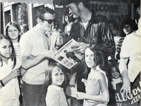 Stompin' Tom Connors signs autographs in Tillsonburg in September 1971. Connors performed at the Strand later that night. He was brought back to Tillsonburg again in 1990 and 1999 by the Tillsonburg Lions for fundraising shows, and he performed once more here in 2006. TILLSONBURG NEWS FILE PHOTO