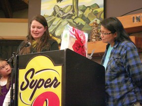 Erika Olson, left presents Judy DaSilva right, with the prestigious 2013 Bread and Roses award. The Award is given to a woman in the Kenora region every year for International Women's Day.