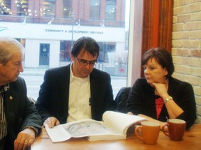 Brant Mayor Ron Eddy, along with Ron Norris and Sandra Parsons from Concerned Citizens of Brant, look over an application to the Ministry of the Environment for a water-taking permit put forth by Dufferin Aggregates. (MICHAEL-ALLAN MARION The Expositor)