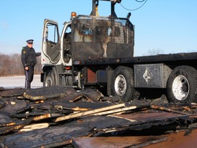A truck carrying insulation board to a construction site in Simcoe Thursday morning caught fire and was destroyed. Const. Ed Sanchuk of the Norfolk OPP, above, says damage could run as high as $350,000. (MONTE SONNENBERG Simcoe Reformer)