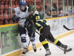 The Melfort Mustangs Adam Fauchoux is bodychecked by Rhett Blackmur of the Humboldt Broncos during the Mustangs' 5-3 loss on Wednesday, March 13 at the Northern Lights Palace.