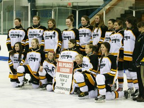 Dunvegan Dynamite Bantam girls with the league banner after their winning game